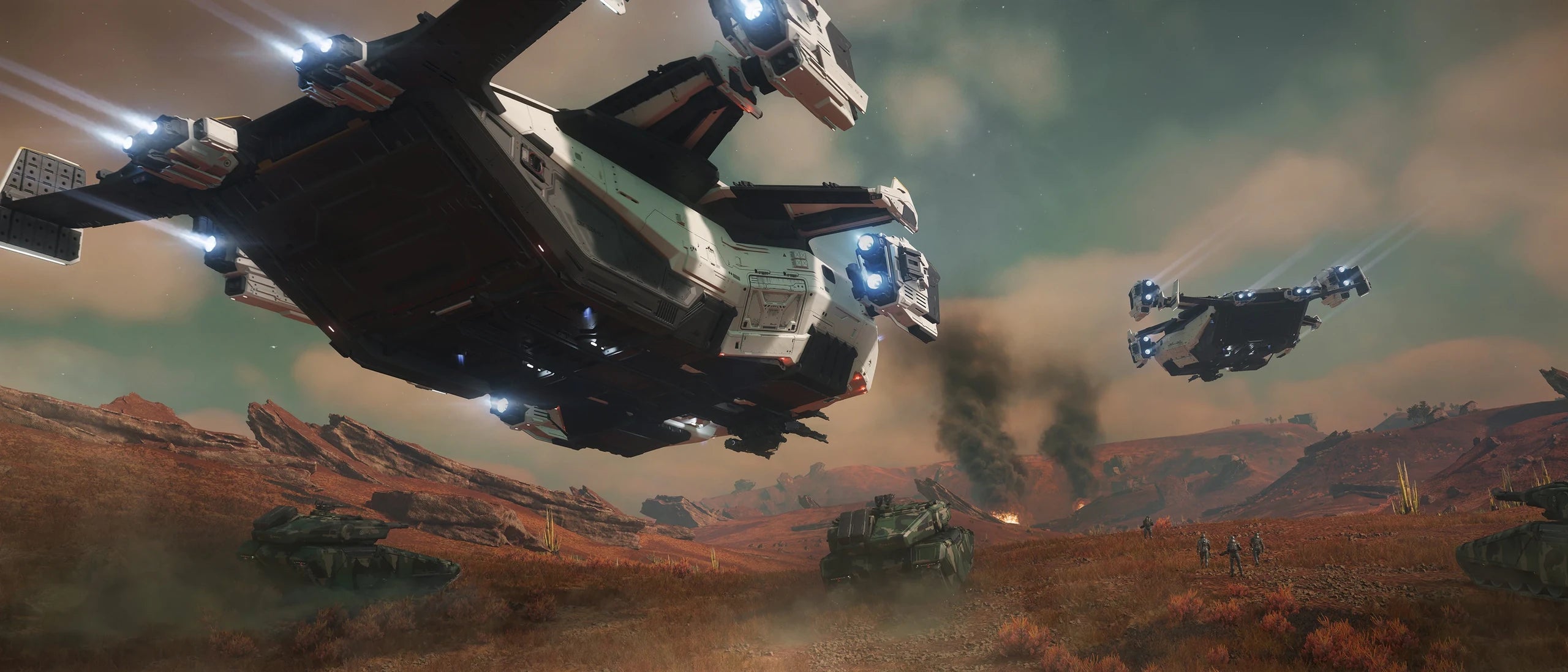 Asgard x2 flying low over tanks and troops
