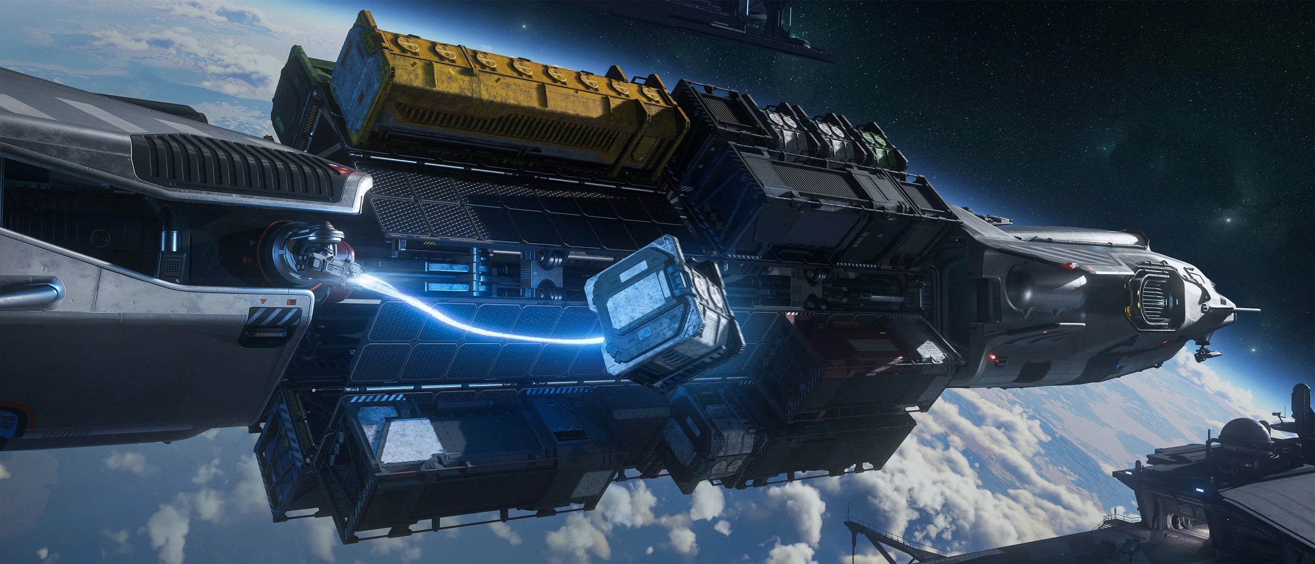 Hull B beside space station using tractor beam to load cargo