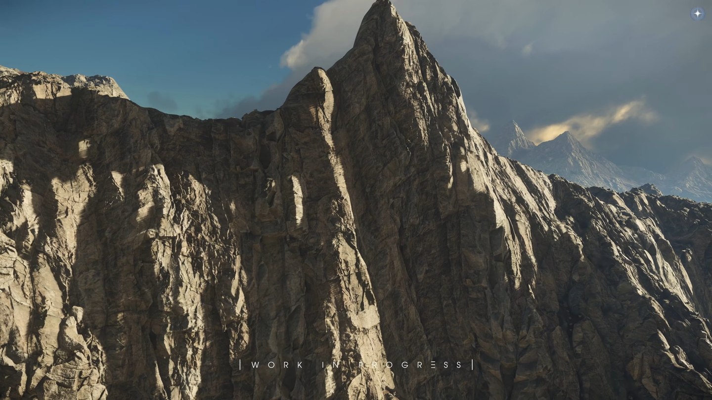 Close view of a steep cliff with layered, fractured rock and a sharp peak.
